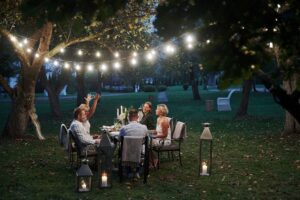 active conversation evening time friends have dinner gorgeous outdoor place